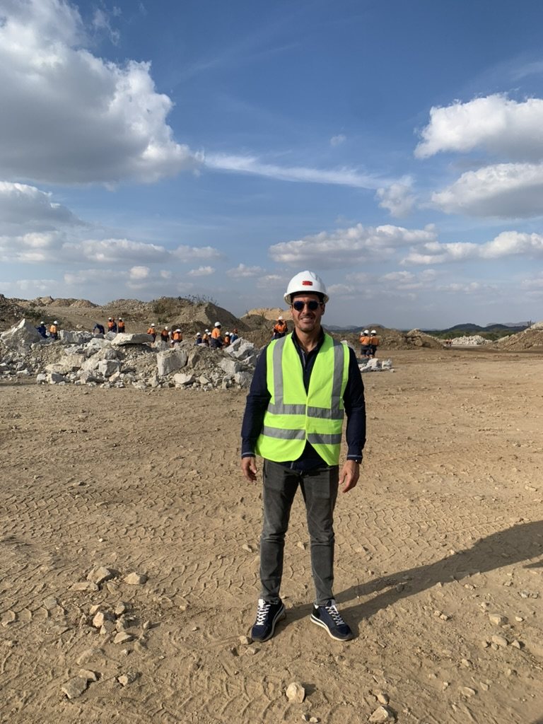 Site visit at Sandawana, with workers in the background